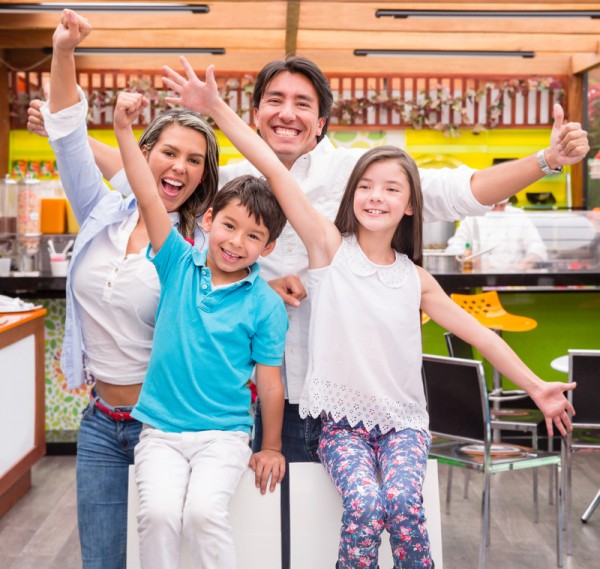 Excited family at a cafeteria